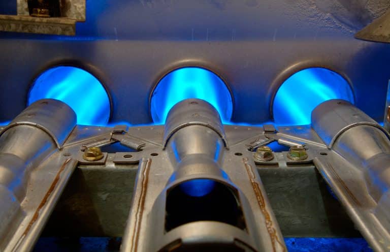 Gas burners firing blue inside a commercial heating unit